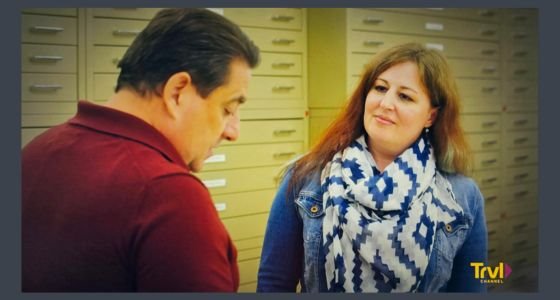 Carrie Drephal looking at a person with index shelves behind her
