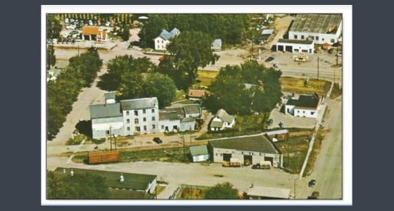 Aerial view of the Teske Coal and Feed Company. The Chaska Farm and Garden is the brick building at bottom right.