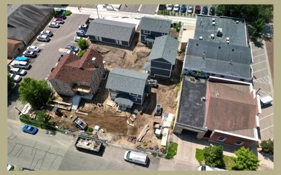 New homes under construction by the historic Ernst house on the Ess lot