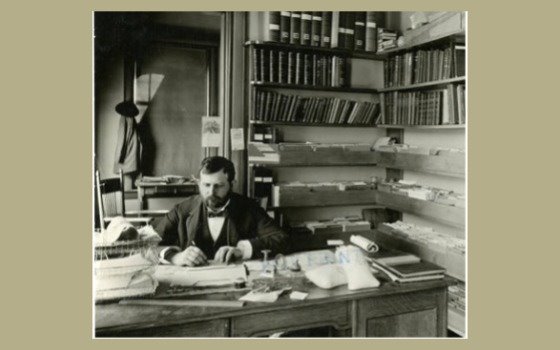 Willet Hays sitting at a desk