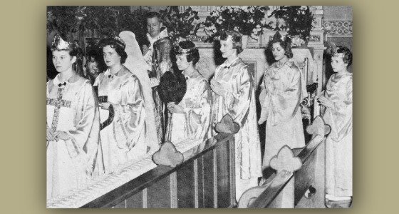 People in robes processing into Guardian Angels church