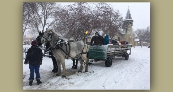 People riding in a horse-drawn carriage
