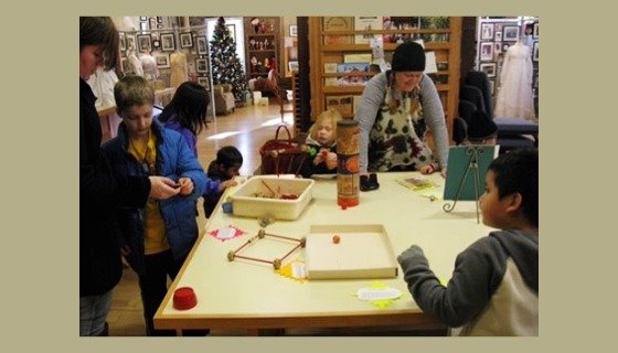 Kids at table playing with old games