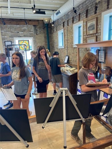 Middle schoolers complete the exhibit Scavenger Hunt activity as part of their visit.