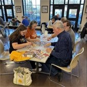 picture of a family doing a puzzle