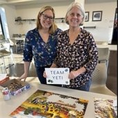 image of two people who completed a puzzle challenge