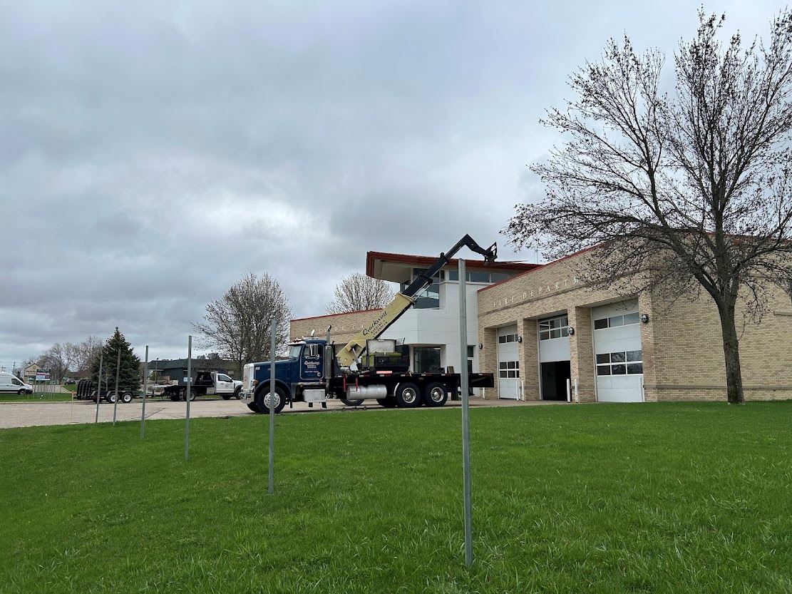 Fencing up and construction trucks ready at the old fire station
